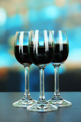 Glasses of liquor,  on bright background