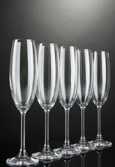 Empty glasses on grey background