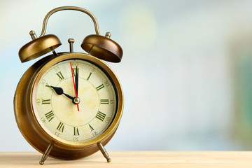 Old alarm clock  on bright background
