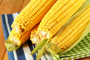 Crude corns on napkin on wooden table