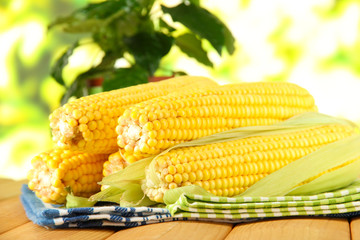 Crude corns on napkin on wooden table on window background