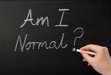 Am I Normal? written on a blackboard