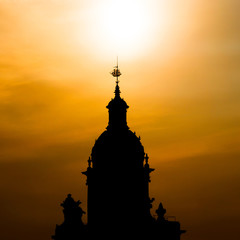 Silhouette of church tower in sunset