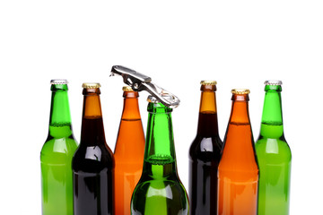 Opener. Bottlenecks. Bottles of beer. Close up.