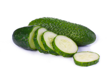 Cucumber and slices isolated over white background