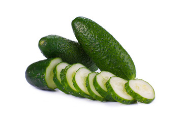 Cucumber and slices isolated over white background