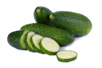 Cucumber and slices isolated over white background