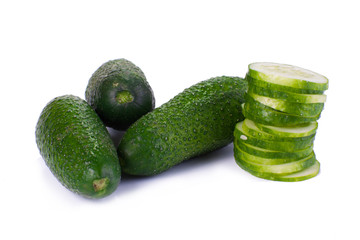 Cucumber and slices isolated over white background