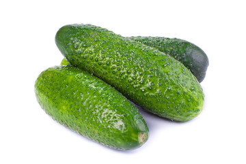 Healthy food. The green cucumbers isolated on white background