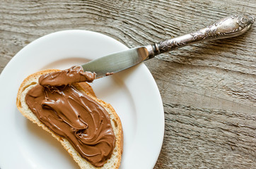 Fototapeta premium Slice of bread with chocolate cream