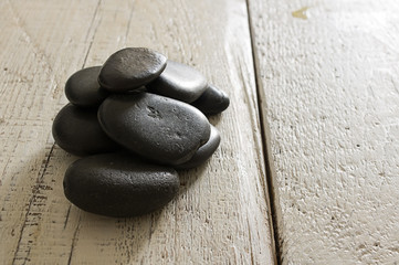 massage stones on the old wooden boards