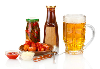 Beer and grilled sausages isolated on white