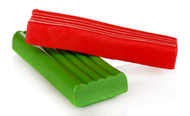 Children bright plasticine isolated on white