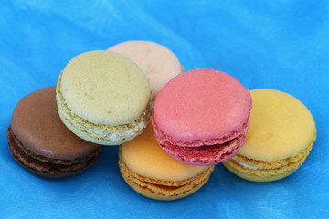 Colorful macaroons on blue background