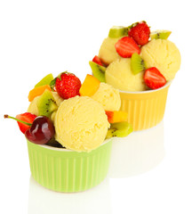 Delicious  ice cream with fruits and berries in bowl isolated