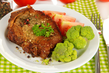 Piece of fried meat on plate close-up