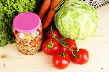 Fresh vegetables and canned on table close up