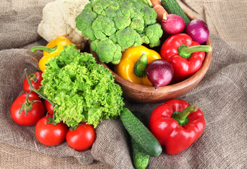 Fresh vegetables on burlap background