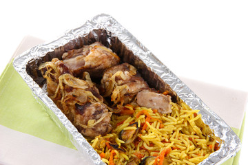 Food in box of foil on napkin  isolated in white
