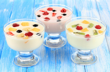Delicious yogurt with fruit on table close-up