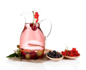 Pitcher of compote with summer berries isolated on white