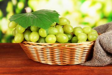 Ripe delicious grapes in wicker basket