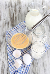 Ingredients for dough on wooden table close-up