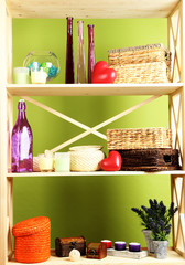 Beautiful white shelves with different home related objects,