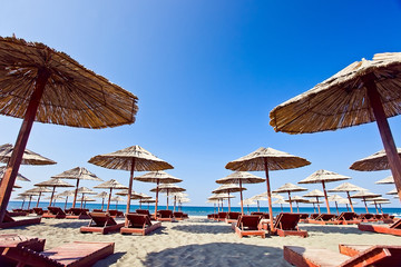 sunbeds and parasols on the beach