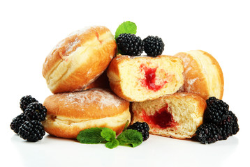 Tasty donuts with berries, isolated on white