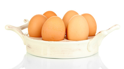 Eggs in plate for eggs isolated on white