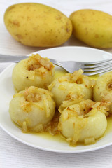 Potato dumplings with fried onions