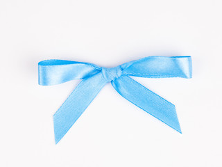 Blue bow with a ribbon isolated on a white backgrounds