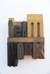 Woodtype letters showing teamwork