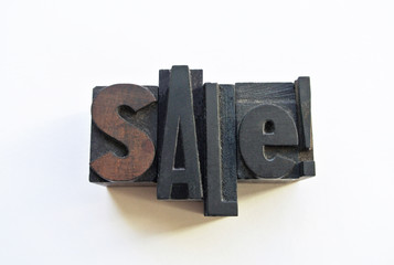 Woodtype letters promoting a sale