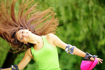 woman roller skating sport activity in park