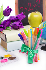 Stationary with flowers and books isolated