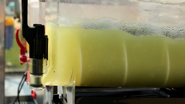 making fresh juice lemonade  in juicer