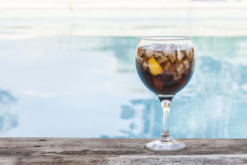 Cola refeshment next to swimming pool