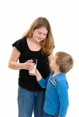 Sister Handing Brother Milk