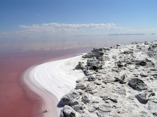 The salty shore of the great Salt Lake with mountains in the bac