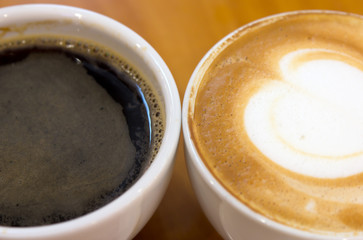 Black coffee and cappucino in the cup
