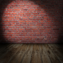 Blank grungy stonewall with spotlights and wooden floor
