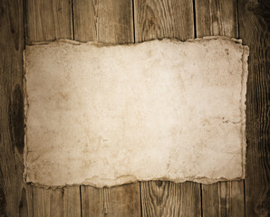 Old paper on the wood background - 54764414