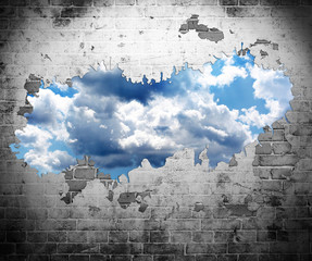Fototapety  stary mur i błękitne niebo z chmurami