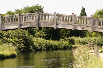 Tudor Style wooden bridge over river	