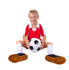 Junge mit Fussball und Trikot