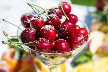 Fresh sweet cherry with sugar powder