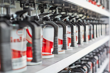 Shelves with tins of automotive paint