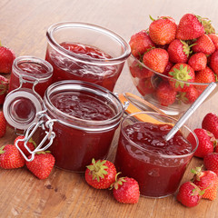 strawberry jam on wood background